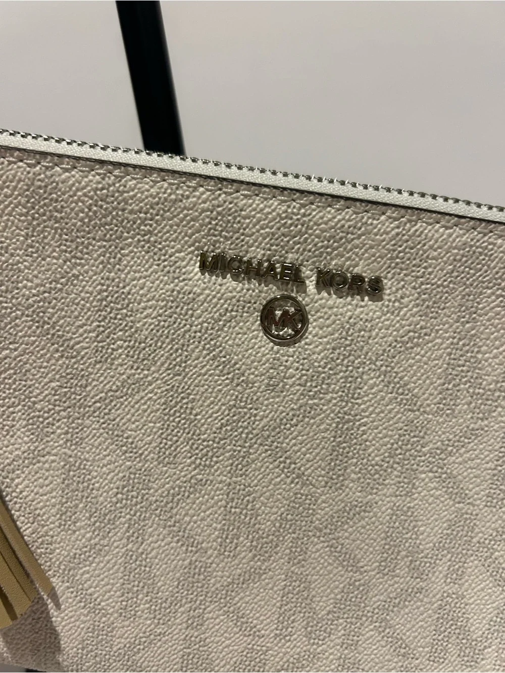 Michael Kors Cream Signature Wristlet with Tassel Charm